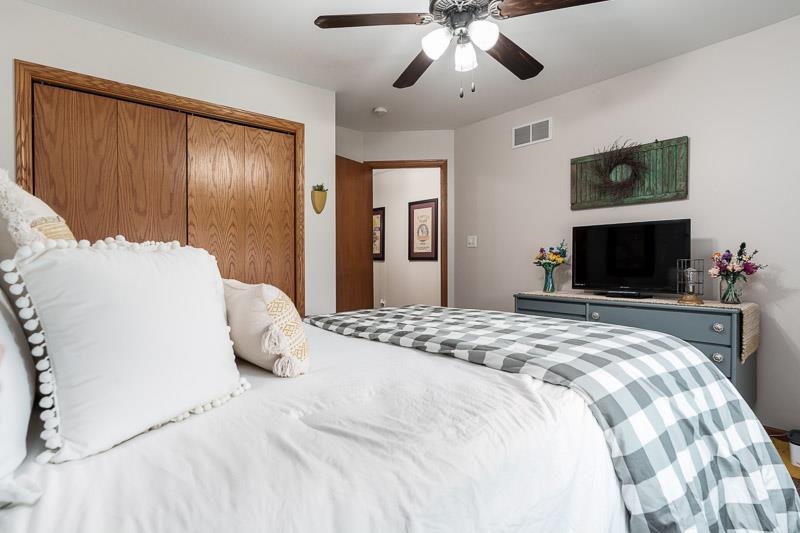 320 Lake Lida Lane Rochelle, IL 61068 - Photo 24 of 43 a bedroom with a large bed and a flat screen tv