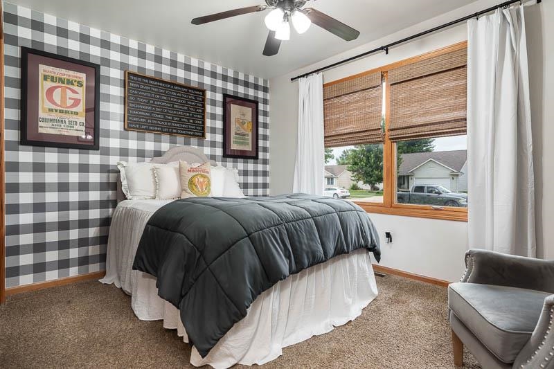 320 Lake Lida Lane Rochelle, IL 61068 - Photo 25 of 43 a bedroom with a bed and glass window