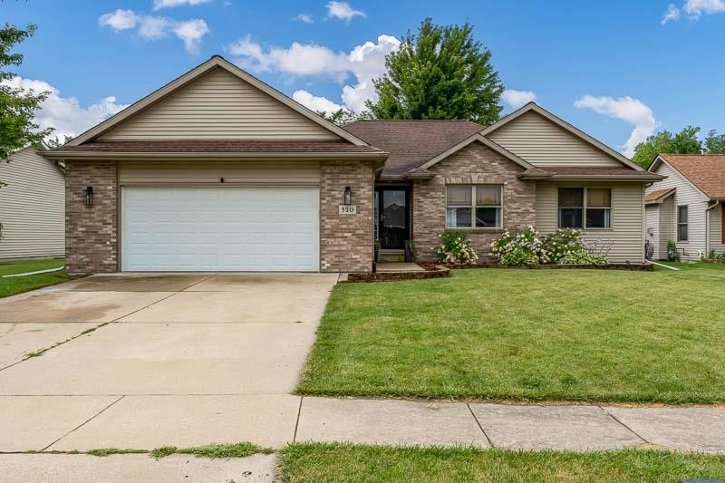 320 Lake Lida Lane Rochelle, IL 61068 - Photo 3 of 43 a front view of a house with a garden