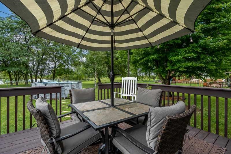320 Lake Lida Lane Rochelle, IL 61068 - Photo 37 of 43 a view of a two chairs and table in the deck