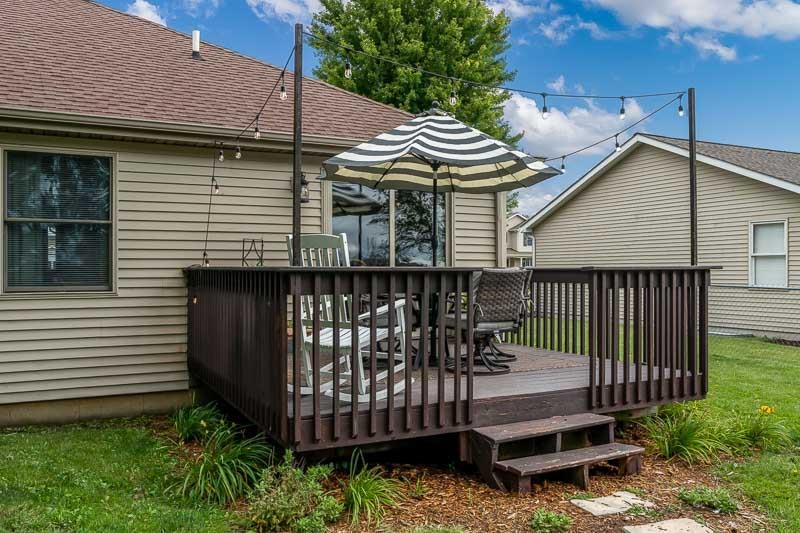 320 Lake Lida Lane Rochelle, IL 61068 - Photo 38 of 43 a front view of a house with a garden