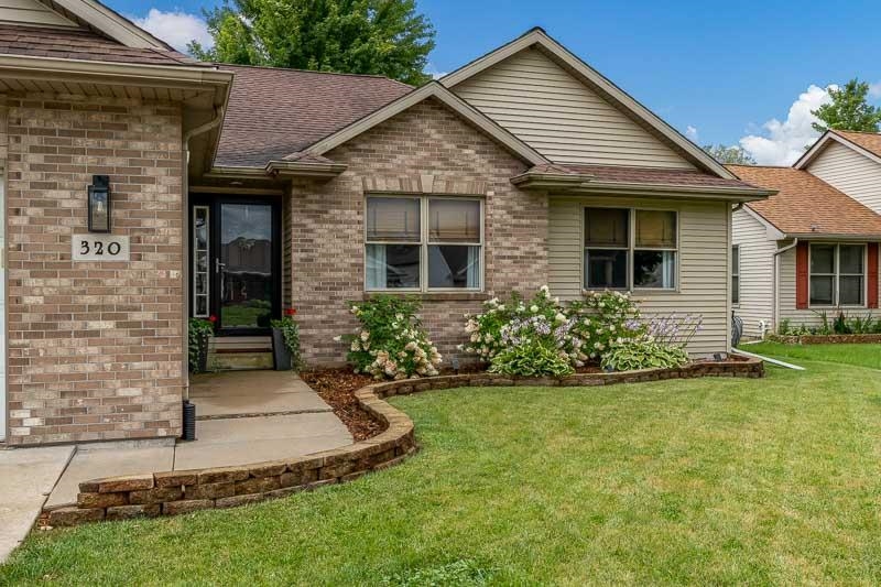 320 Lake Lida Lane Rochelle, IL 61068 - Photo 4 of 43 a front view of a house with a yard