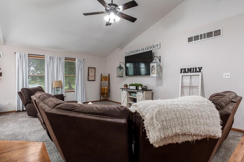 320 Lake Lida Lane Rochelle, IL 61068 - Photo 6 of 43 a living room with furniture and a flat screen tv