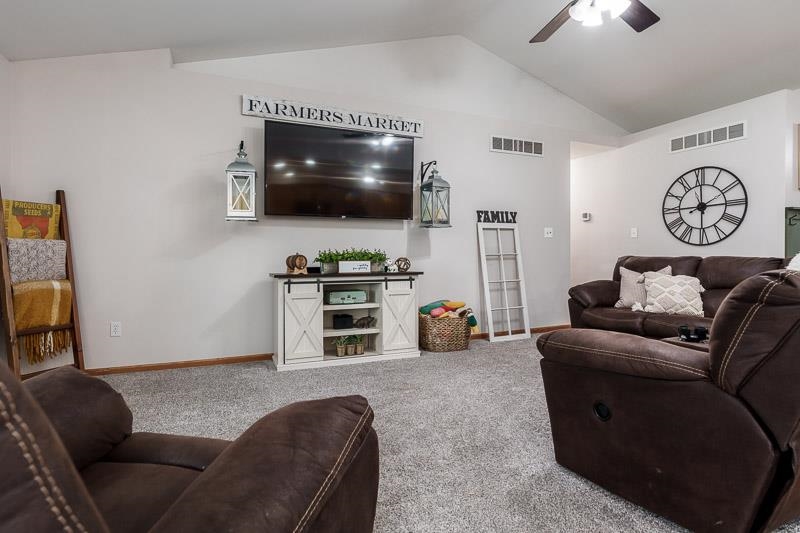 320 Lake Lida Lane Rochelle, IL 61068 - Photo 9 of 43 a living room with furniture and a flat screen tv