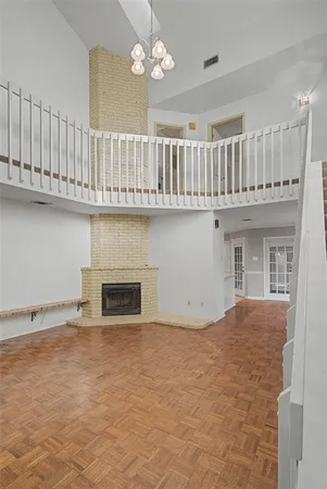 a view of an empty room with a fireplace