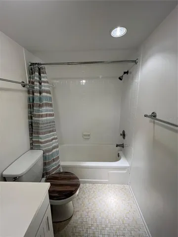 a view of living room with furniture and floor to ceiling window