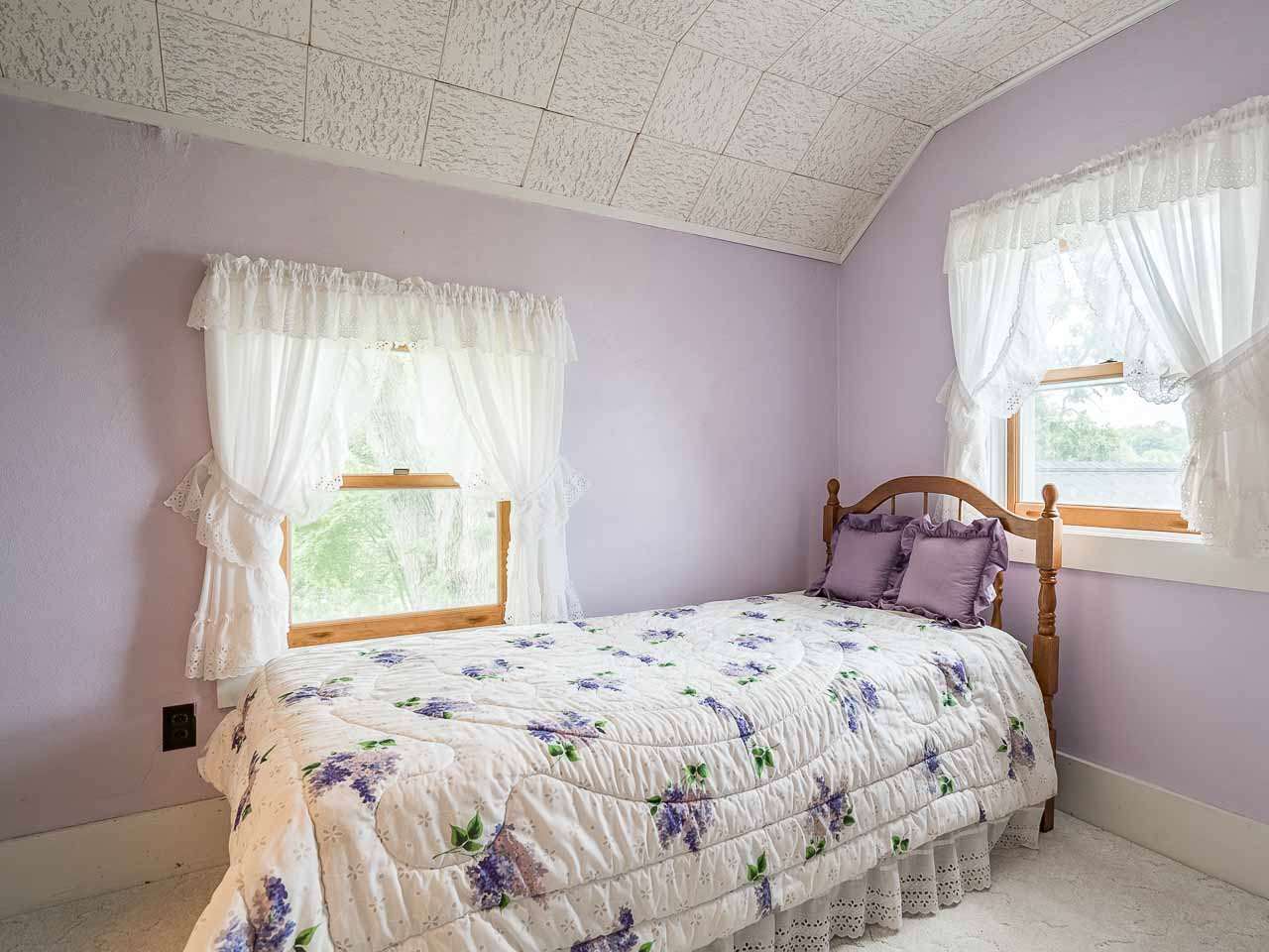 10208 Center Road Durand, IL 61024 - Photo 22 of 25 a bedroom with a bed and a window