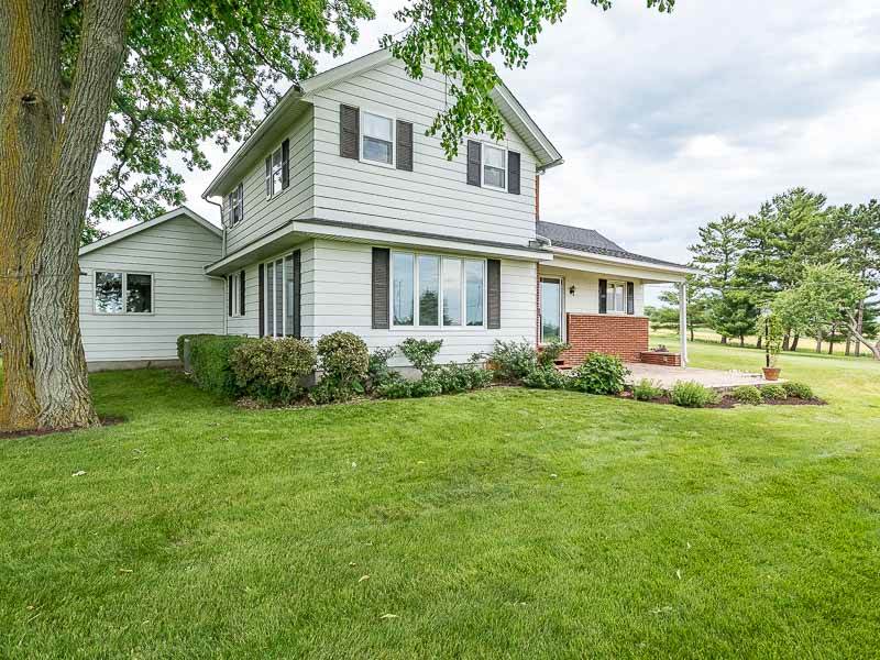 10208 Center Road Durand, IL 61024 - Photo 5 of 25 a front view of a house with a garden