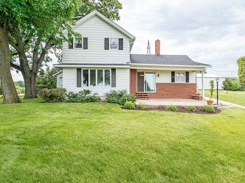 10208 Center Road Durand, IL 61024 - Photo 6 of 25 a front view of a house with a garden