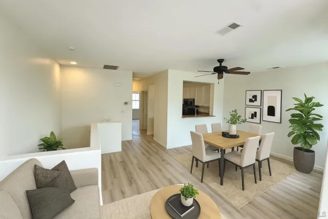 a view of a livingroom with furniture and wooden floor