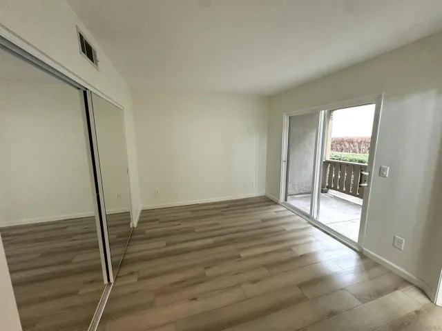 a view of entryway with wooden floor