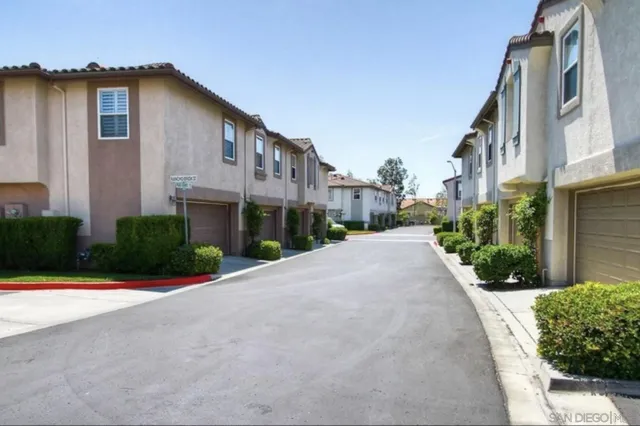 a front view of a house with a yard and a garage