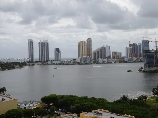 an aerial view of a house with a swimming pool yard and outdoor seating