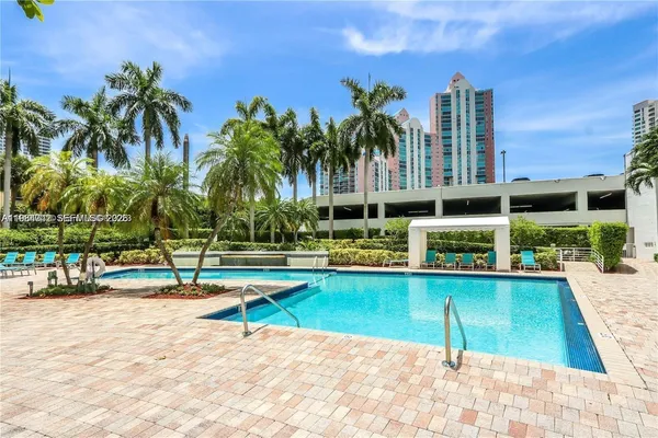 a living room with furniture and white walls