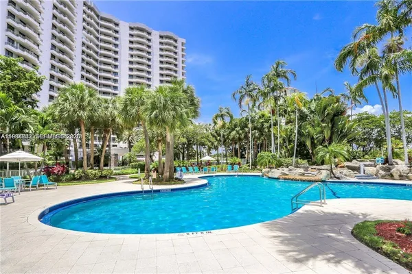 a living room with furniture and white walls