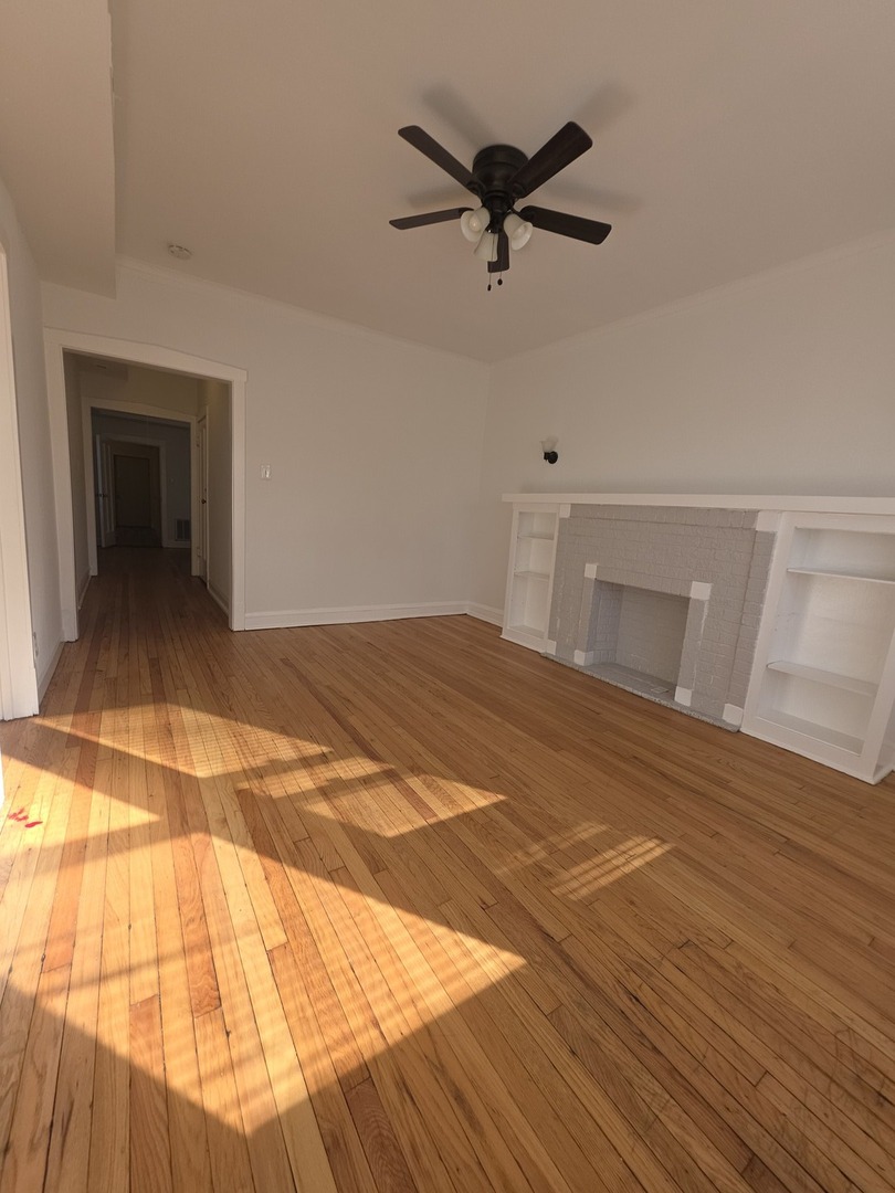 5816 West Chicago Avenue, Unit 2 Chicago, IL 60651 - Photo 3 of 10 a view of a livingroom with a hall and wooden floor