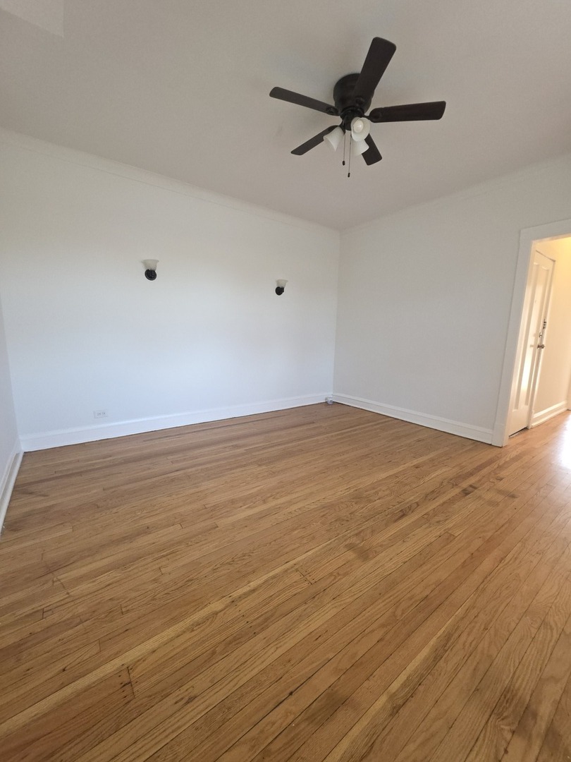 5816 West Chicago Avenue, Unit 2 Chicago, IL 60651 - Photo 6 of 10 wooden floor in empty room