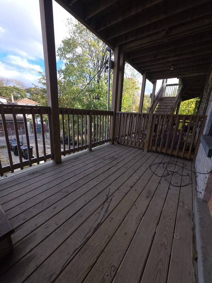 5816 West Chicago Avenue, Unit 2 Chicago, IL 60651 - Photo 9 of 10 a view of balcony with wooden floor