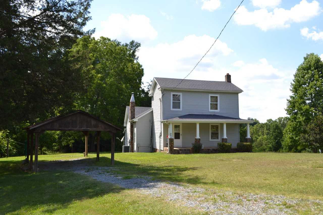 1633 Hatchett Road Penhook, VA 24137 - Photo 1 of 15 a view of a yard in front of a house with large trees