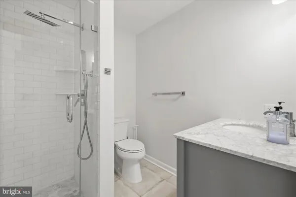 a bedroom with a large bed and a dresser