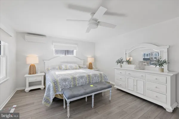 a bedroom with two beds and a window