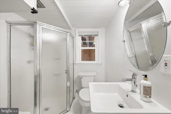 a spacious bedroom with a bed and a window