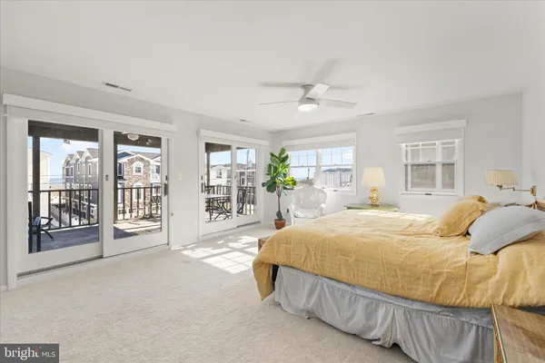 a bathroom with a granite countertop sink a mirror and a shower