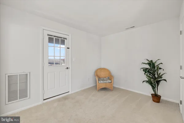 a view of a city from a balcony with furniture