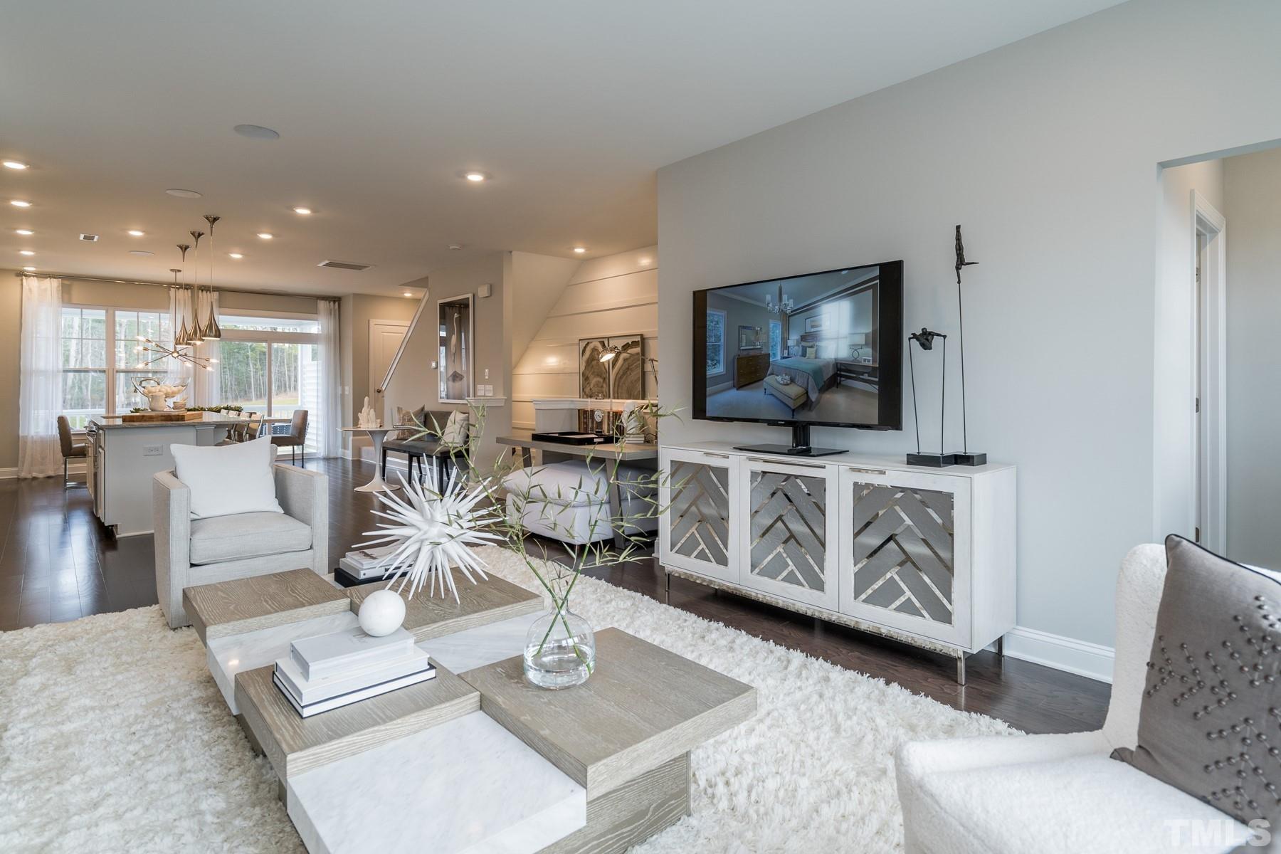 2225 Kettle Falls Station, Unit 392 Apex, NC 27502 - Photo 24 of 52 a living room with furniture and a flat screen tv