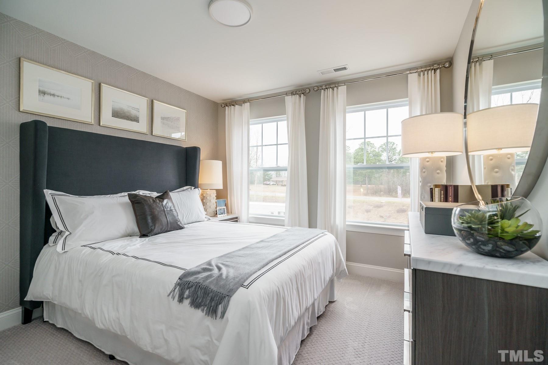 2225 Kettle Falls Station, Unit 392 Apex, NC 27502 - Photo 40 of 52 a bedroom with a bed and a window