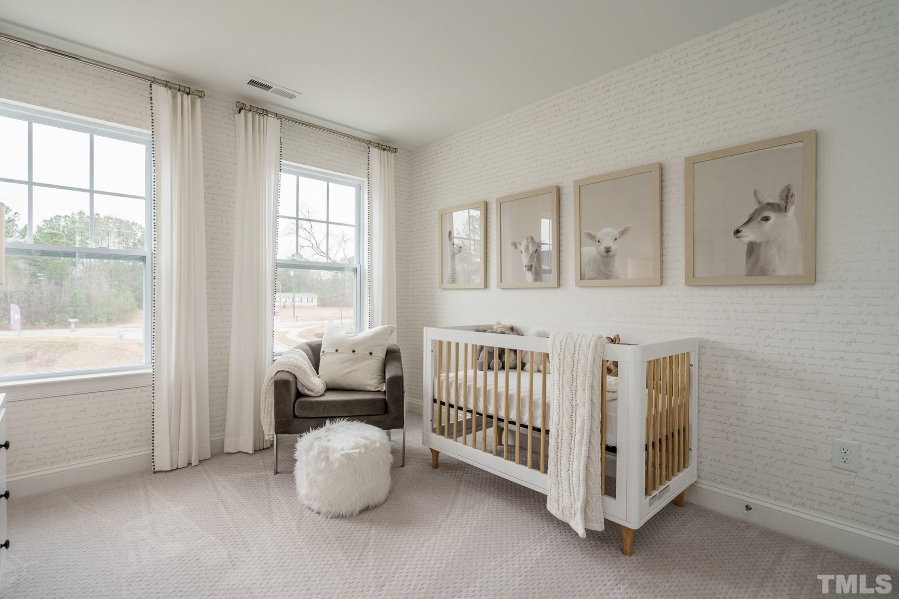2225 Kettle Falls Station, Unit 392 Apex, NC 27502 - Photo 41 of 52 a bedroom with furniture and windows