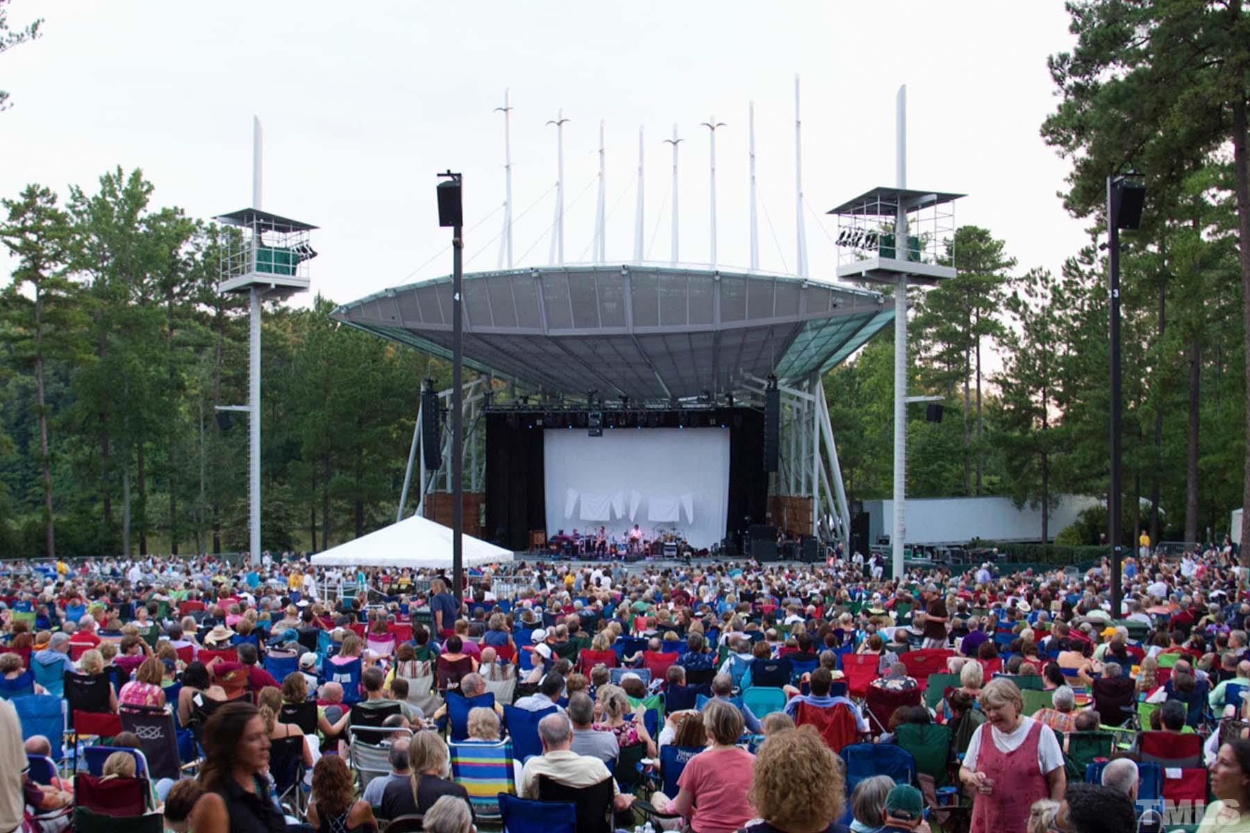 2225 Kettle Falls Station, Unit 392 Apex, NC 27502 - Photo 50 of 52 a group of people standing around a fruit stand