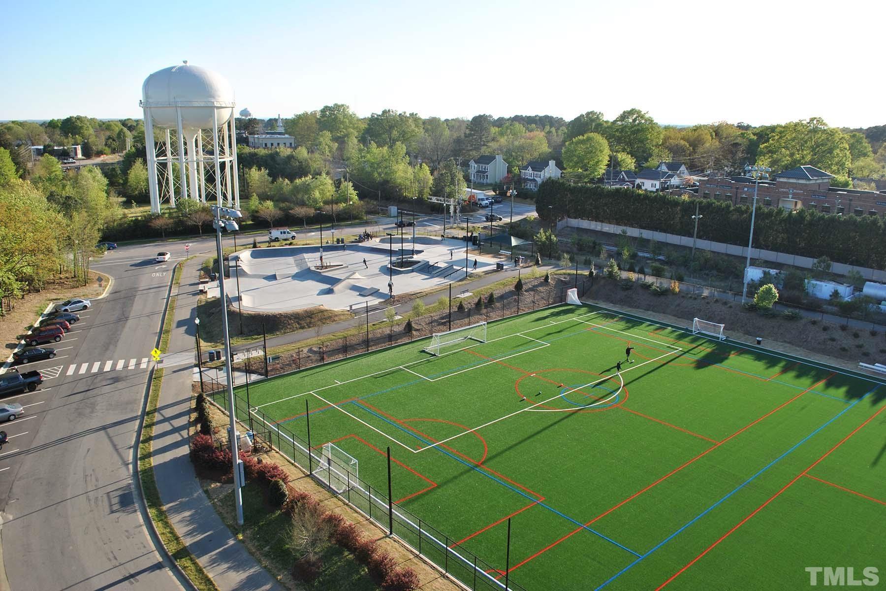 2225 Kettle Falls Station, Unit 392 Apex, NC 27502 - Photo 52 of 52 a view of a tennis ground with large trees
