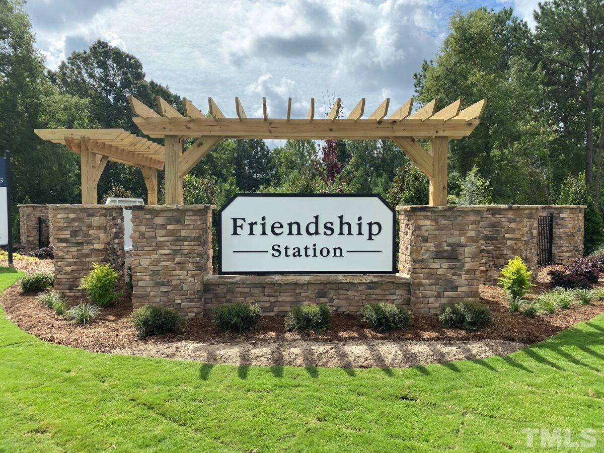 2225 Kettle Falls Station, Unit 392 Apex, NC 27502 - Photo 10 of 52 a sign that is on a brick wall