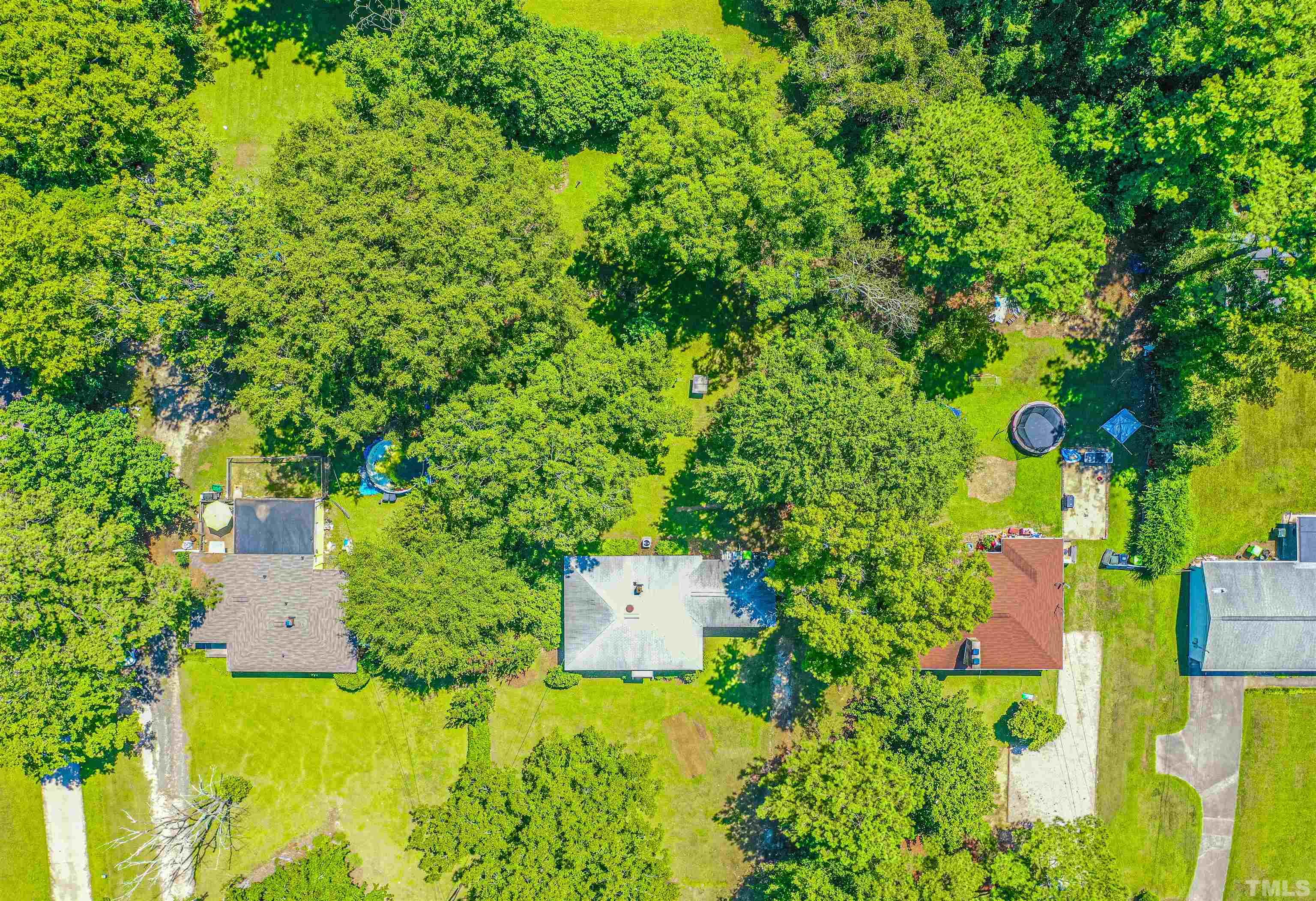 457 Rose Lane Raleigh, NC 27610 - Photo 23 of 26 an aerial view of a house with a yard basket ball court and outdoor seating