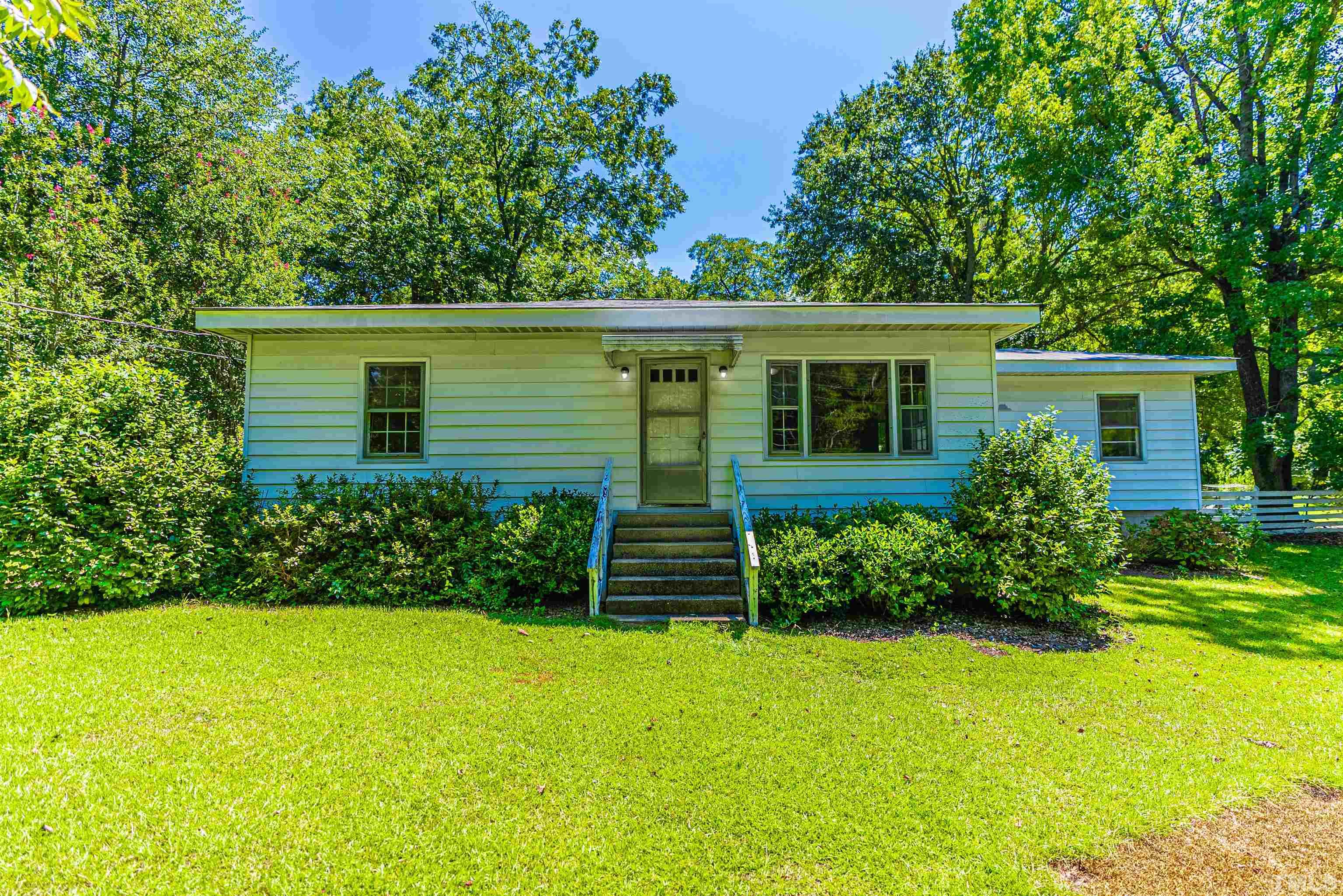 457 Rose Lane Raleigh, NC 27610 - Photo 3 of 26 front view of a house with a yard