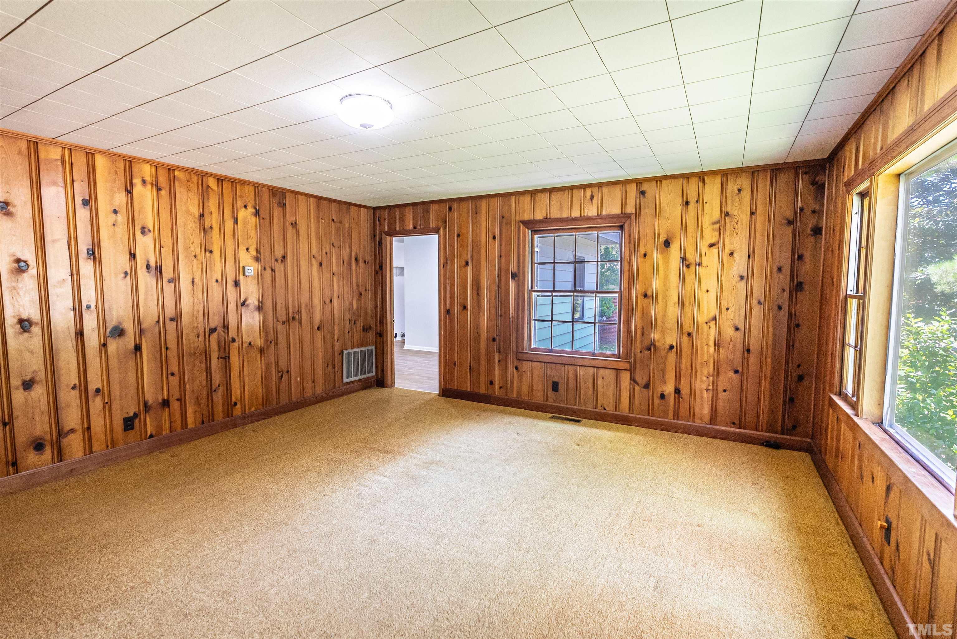 457 Rose Lane Raleigh, NC 27610 - Photo 5 of 26 a view of an empty room with a window