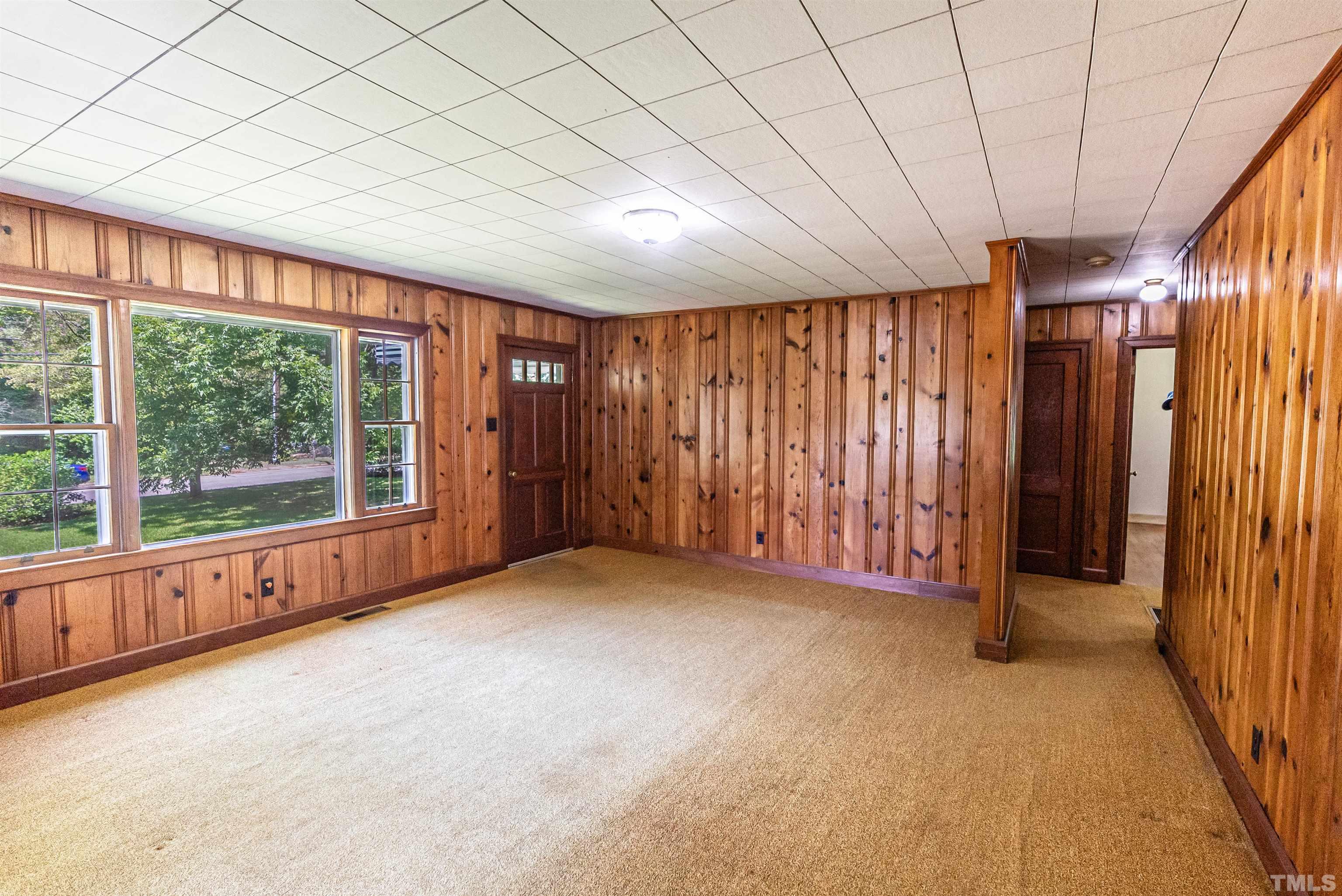 457 Rose Lane Raleigh, NC 27610 - Photo 6 of 26 an empty room with windows