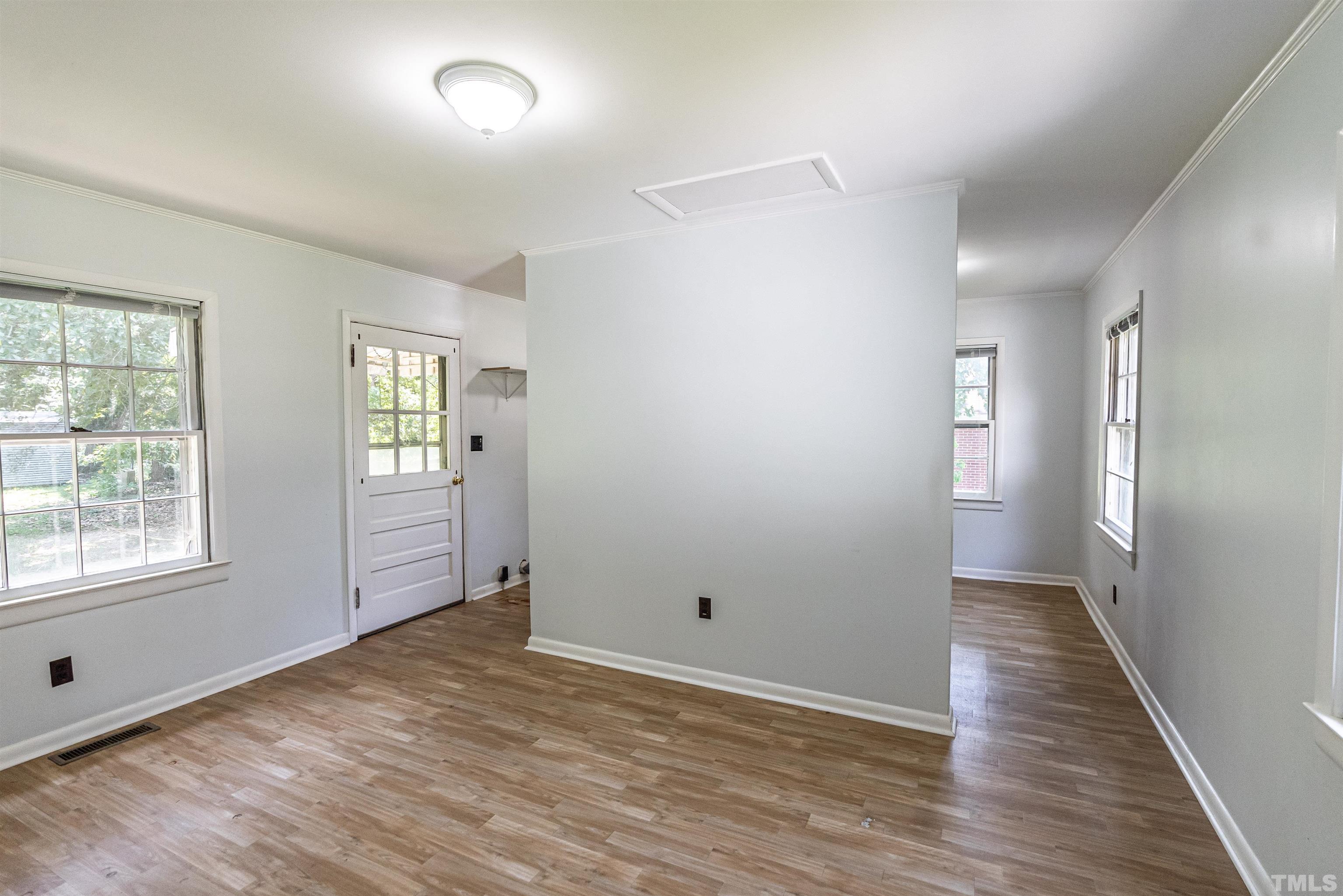 457 Rose Lane Raleigh, NC 27610 - Photo 7 of 26 an empty room with windows and closet