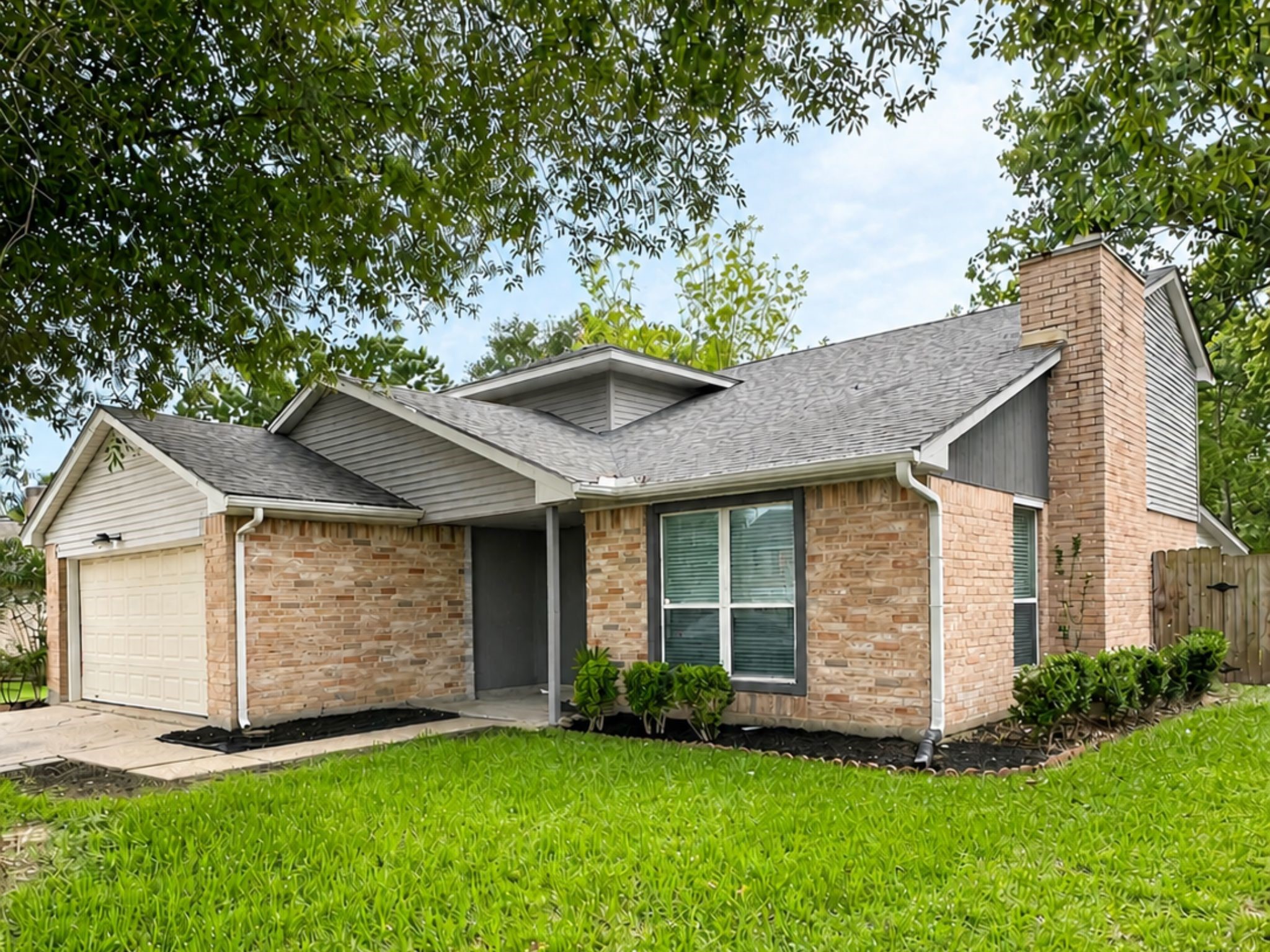 5323 Windsong Trail Houston, TX 77084 - Photo 6 of 30 This inviting 2 Story brick home features a welcoming covered entry, fresh landscaping, and a two-car garage.
