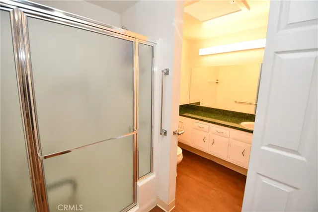 a kitchen with stainless steel appliances granite countertop a refrigerator a sink and dishwasher