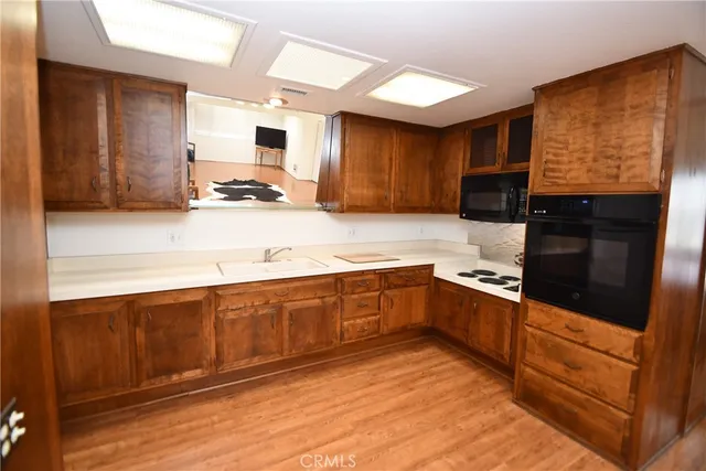 a view of a bedroom with wooden floor and bedroom
