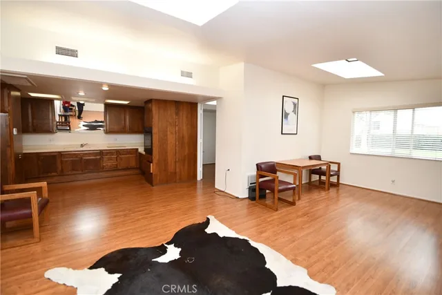 a front view of house with a garden and patio