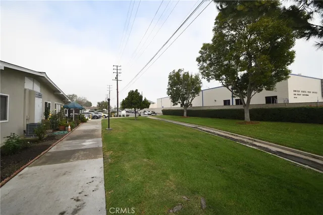 a view of a street with a building and a street sign