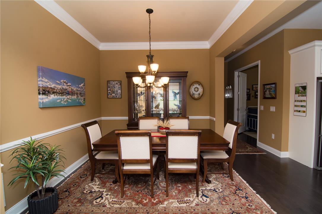 4097 Rutz Lane Allentown, PA 18104 - Photo 20 of 59 Elegant crown molding and rich hardwood flooring define this formal dining space.