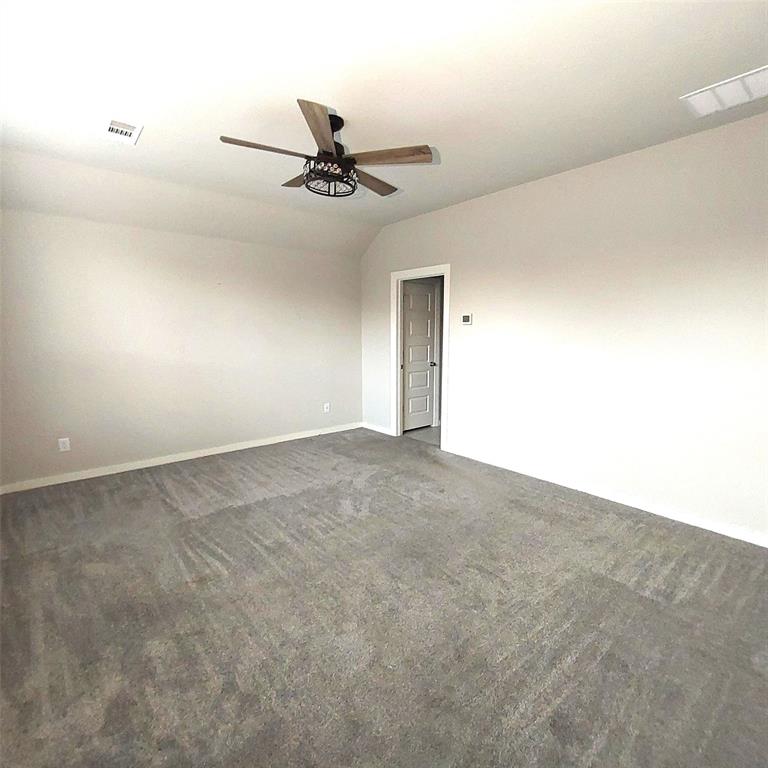 1813 Huntsman Way Forney, TX 75126 - Photo 11 of 18 an empty room with a ceiling fan and a window