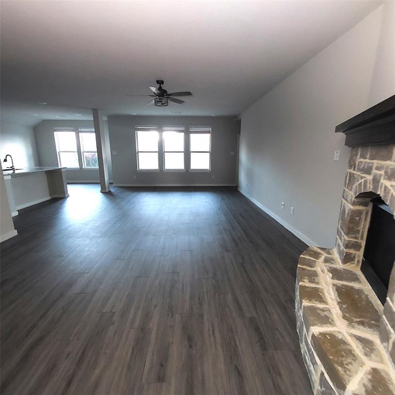 1813 Huntsman Way Forney, TX 75126 - Photo 2 of 18 wooden floor in an empty room with a window
