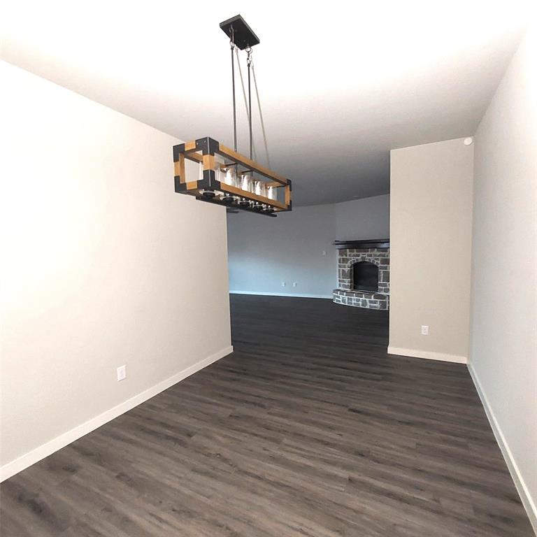 1813 Huntsman Way Forney, TX 75126 - Photo 9 of 18 a view of empty room with wooden floor