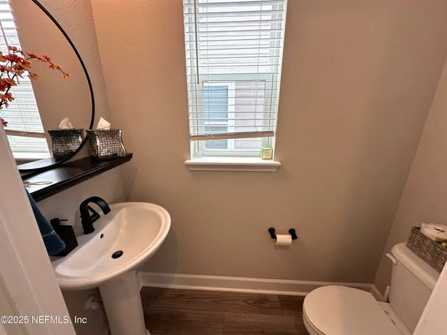 a view of walk in closet with clothes