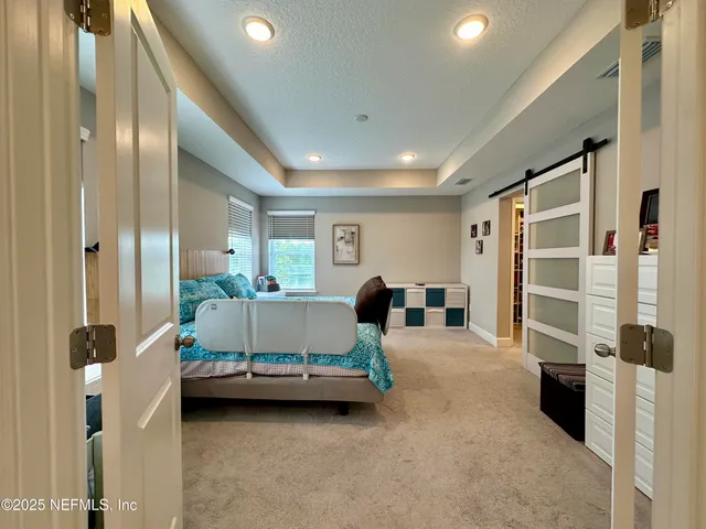 a spacious bathroom with a granite countertop sink mirror and shower